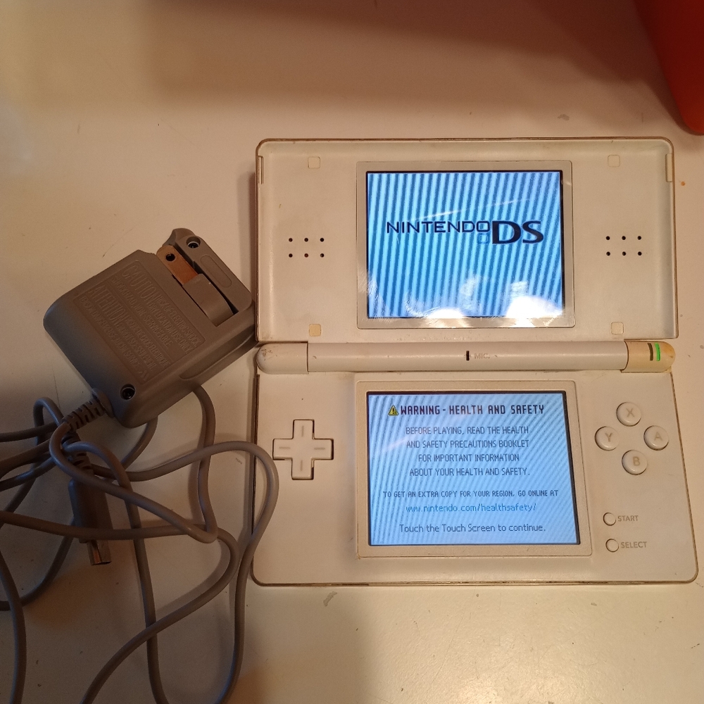 White Nintendo DS Lite with charger